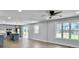 Bright and airy living space with a modern kitchen, windows, and wood floors at 341 Sugar Hill Rd, Saint George, SC 29477