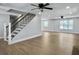 Large living room with recessed lighting, new flooring, and a staircase at 341 Sugar Hill Rd, Saint George, SC 29477