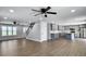 Open-concept living space with modern gray kitchen and stylish hardwood floors at 341 Sugar Hill Rd, Saint George, SC 29477