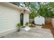 Charming backyard featuring a storage shed, mature trees, and a paved patio area at 35 Campbell Dr, Charleston, SC 29407