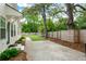 Large backyard with a new fence, healthy grass, and a cement patio at 35 Campbell Dr, Charleston, SC 29407