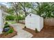 Spacious backyard featuring a storage shed, mature trees, and well-maintained landscaping at 35 Campbell Dr, Charleston, SC 29407