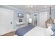 Stylish bedroom with a hanging chair, vanity and TV at 35 Campbell Dr, Charleston, SC 29407