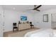 Cozy bedroom featuring hardwood floors, a ceiling fan, and a dresser beneath a wall-mounted television at 35 Campbell Dr, Charleston, SC 29407