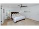 Elegant bedroom with a ceiling fan, beautiful rug, and plantation shutters allowing natural light at 35 Campbell Dr, Charleston, SC 29407