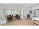 Bright dining area with shiplap walls, bench seating, and natural light flowing to the kitchen at 35 Campbell Dr, Charleston, SC 29407