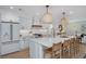 Gourmet kitchen featuring white cabinets, a center island with barstool seating, and stainless steel appliances at 35 Campbell Dr, Charleston, SC 29407