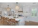 Spacious white kitchen with a large island, modern appliances, pendant lights, and seating at 35 Campbell Dr, Charleston, SC 29407