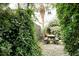 Cozy backyard featuring a wooden picnic table surrounded by lush greenery for a private outdoor space at 3.5 Kracke St # C, Charleston, SC 29403