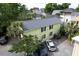 Backyard featuring a two story home with a driveway and several vehicles parked on gravel at 3.5 Kracke St # C, Charleston, SC 29403