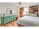 Bedroom with a vibrant green dresser, wood floors, and a bright window providing natural light at 3.5 Kracke St # C, Charleston, SC 29403