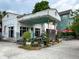 Unique building featuring outdoor picnic tables and lush plant accents, creating a welcoming atmosphere at 3.5 Kracke St # C, Charleston, SC 29403