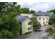 Charming neighborhood houses featuring gravel driveways, verdant trees, and an inviting curb appeal at 3.5 Kracke St # C, Charleston, SC 29403