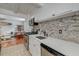 Modern kitchen with stainless steel appliances, white cabinets, tile backsplash and lots of natural light at 3.5 Kracke St # C, Charleston, SC 29403