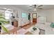 Bright living room boasts modern decor, hardwood floors, and a seamless flow into the kitchen at 3.5 Kracke St # C, Charleston, SC 29403