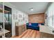 Bright living room with a brick accent wall, wooden floors, and comfortable seating at 3.5 Kracke St # C, Charleston, SC 29403