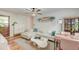 Inviting living room with a cream-colored sectional sofa, modern coffee table, and beautiful wood floors at 3.5 Kracke St # C, Charleston, SC 29403