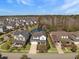 Overhead view of a lovely neighborhood with houses surrounding a scenic pond and green spaces at 3608 Maidstone Dr, Mount Pleasant, SC 29466