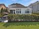 Spacious backyard view with a covered patio area perfect for outdoor entertaining and relaxation at 3608 Maidstone Dr, Mount Pleasant, SC 29466