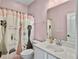 Pink bathroom featuring vanity, toilet and shower with decorative curtain at 3608 Maidstone Dr, Mount Pleasant, SC 29466