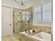 Luxurious bathroom with a soaking tub, tiled shower, and ample natural light at 3608 Maidstone Dr, Mount Pleasant, SC 29466