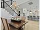Dining room with modern chandelier and a large dining table with seating for a warm and inviting ambiance at 3608 Maidstone Dr, Mount Pleasant, SC 29466