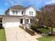 Beautiful two-story home featuring a well-manicured lawn, inviting porch, and a two-car garage at 3608 Maidstone Dr, Mount Pleasant, SC 29466
