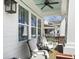 Cozy front porch featuring comfortable seating, stylish decor, and a view of the neighborhood at 3608 Maidstone Dr, Mount Pleasant, SC 29466
