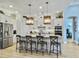 Bright kitchen features a large island with counter seating, stainless steel appliances, and pendant lighting at 3608 Maidstone Dr, Mount Pleasant, SC 29466