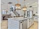 Kitchen features an island with barstool seating and modern pendant lights at 3608 Maidstone Dr, Mount Pleasant, SC 29466