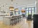 Open-concept living area connecting to a modern kitchen and fireplace at 3608 Maidstone Dr, Mount Pleasant, SC 29466