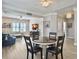 Bright living room with dining area, wood floors, and views of the seating area with large TV at 3608 Maidstone Dr, Mount Pleasant, SC 29466
