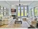 Light-filled living room with a fireplace, large windows, and comfortable seating at 3608 Maidstone Dr, Mount Pleasant, SC 29466