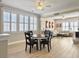 Bright and open living area with wood floors, large windows, and connected dining space at 3608 Maidstone Dr, Mount Pleasant, SC 29466