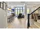 Open-concept living room with hardwood floors, fireplace and barstool seating at the kitchen island at 3608 Maidstone Dr, Mount Pleasant, SC 29466