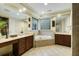 The bathroom features a corner bathtub, double vanity, and neutral tile at 3924 Regal Oak Ln, Johns Island, SC 29455