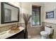 Bathroom with a unique sink, decorative mirror, and a privacy window at 3924 Regal Oak Ln, Johns Island, SC 29455