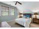 Inviting bedroom featuring a bed with a wicker headboard and windows that provide great light at 3924 Regal Oak Ln, Johns Island, SC 29455