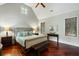 Bedroom with a tufted headboard, natural light, and wooden bench at 3924 Regal Oak Ln, Johns Island, SC 29455