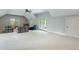 Expansive bonus room offering ample space with neutral carpet and a sliding glass door to the outdoors at 3924 Regal Oak Ln, Johns Island, SC 29455