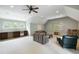 Spacious bonus room featuring neutral carpet, a ceiling fan, and a kitchenette area at 3924 Regal Oak Ln, Johns Island, SC 29455