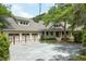 Charming home featuring a three-car garage, and welcoming front porch with manicured landscaping at 3924 Regal Oak Ln, Johns Island, SC 29455
