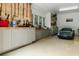 Well-organized garage space with cabinets, work bench, and car at 3924 Regal Oak Ln, Johns Island, SC 29455