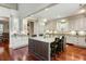 Well-appointed kitchen boasting a large island, granite countertops, and stainless steel appliances at 3924 Regal Oak Ln, Johns Island, SC 29455