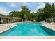 A refreshing community pool area with plenty of lounge chairs and shade at 3924 Regal Oak Ln, Johns Island, SC 29455