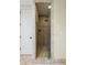 The tiled walk-in shower features glass enclosure, rainfall shower head, and bench at 3924 Regal Oak Ln, Johns Island, SC 29455