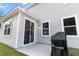 Exterior view of a home with a patio, grill, sliding glass door, and neutral siding at 3952 Treebranch Cir Cir, Mount Pleasant, SC 29429
