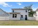 Well-maintained backyard featuring a white fence, green lawn, and the home's rear elevation at 3952 Treebranch Cir Cir, Mount Pleasant, SC 29429