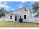 Backyard view of a home with neutral siding, patio, a grill, green grass and a white fence at 3952 Treebranch Cir Cir, Mount Pleasant, SC 29429