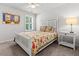 Bedroom featuring a ceiling fan, window with shutters, bed, and side table with lamp at 3952 Treebranch Cir Cir, Mount Pleasant, SC 29429